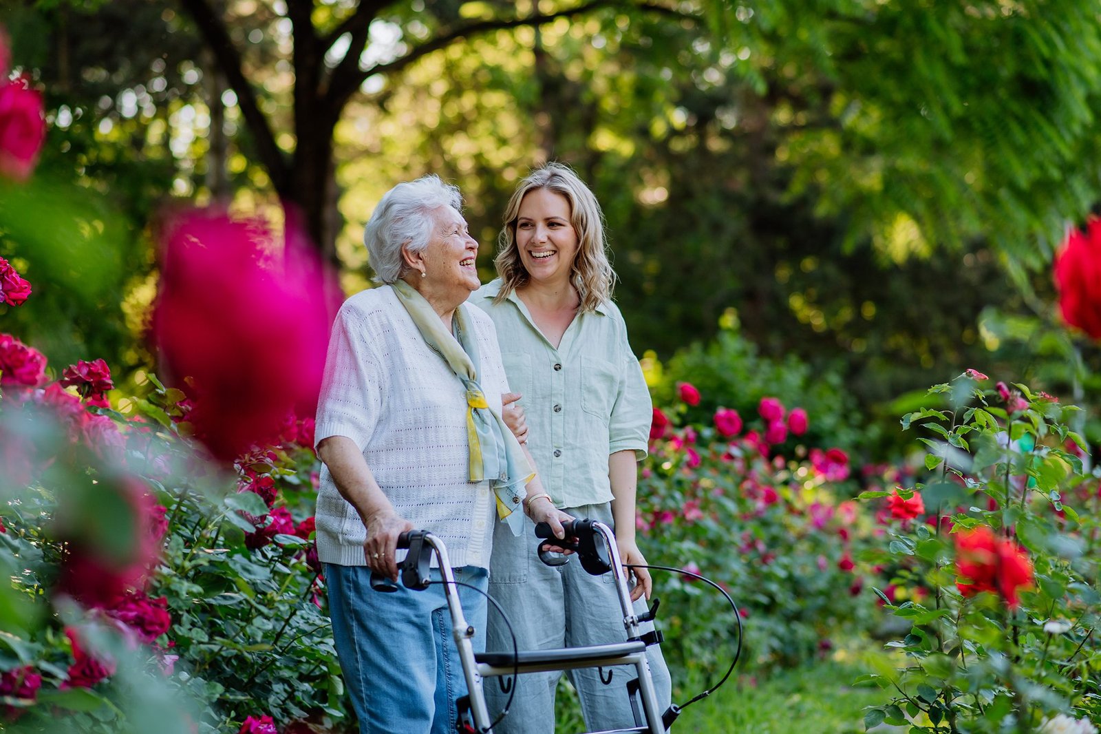 Two women in a rose garden. Aged care